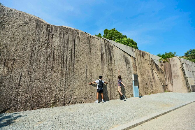 Osaka Castle Walking Tour and Castle Tower Admission - Inside Osaka Castle: walls, moats, gates, and samurai-era thinking