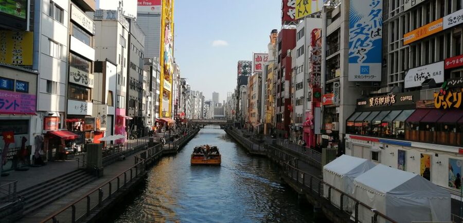Osaka: Five Must-See Highlights Walking Tour & Ramen Lunch - Dotonbori and the Running Man moment over Ebisbashi