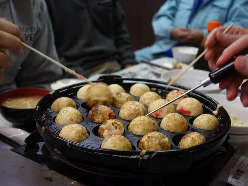 Osaka: Food Tour Kuromon Market & Dotonbori with Guide - Wanaka Takoyaki: Crispy Edges, Creamy Center
