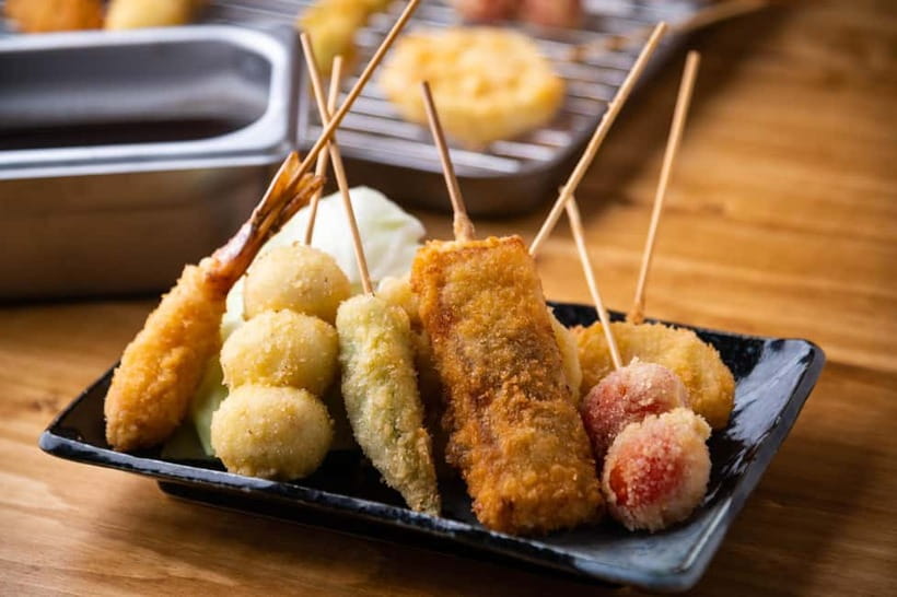 Osaka: Food Tour Kuromon Market & Dotonbori with Guide - Okonomiyaki: Osaka’s Savory Pancake Energy