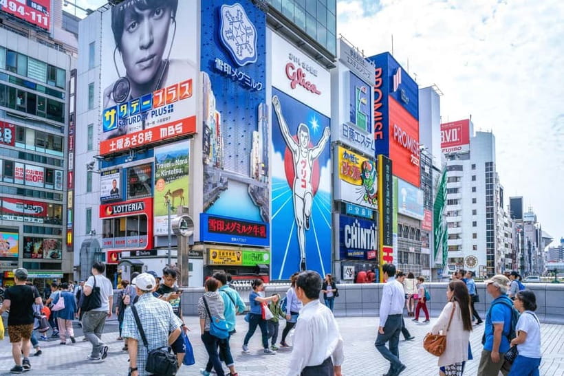 Osaka: Food Tour Kuromon Market & Dotonbori with Guide - Dotonbori Neon and the Ebisu Bridge Glico Sign Photo Stop