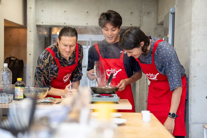 Osaka Home Feast Cooking and Sake Experience - Inside the cozy cooking studio with a MagicalTrip apron