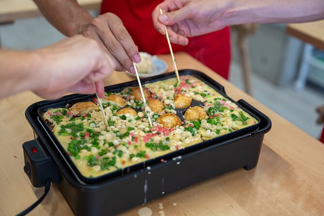 Osaka Home Feast Cooking and Sake Experience - Cooking the classics: crispy takoyaki, wasabi tuna, and chicken with mayo and ponzu