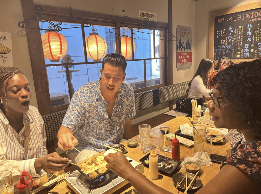 Osaka: Izakaya Bars Guided Walking Tour - Meeting at the Dotombori Humanity Song Monument by Glico