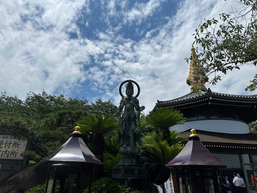 Osaka: Japan’s Oldest Temple & Bone Buddha Walking Tour - Finding Your Guide at Shitennoji’s Stone Torii Gate