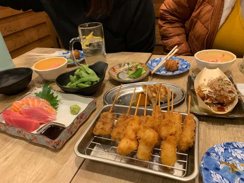 Osaka: Namba Pub Bar Crawl with a Local Guide - Stop 1 in Namba: snacks first, then beer and spirits