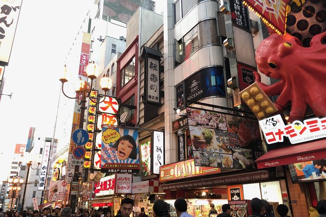 Osaka Private Pop Culture Tour: Historic Tenma to Dotonbori - The long arcade experience: snack stalls and old-school storefronts