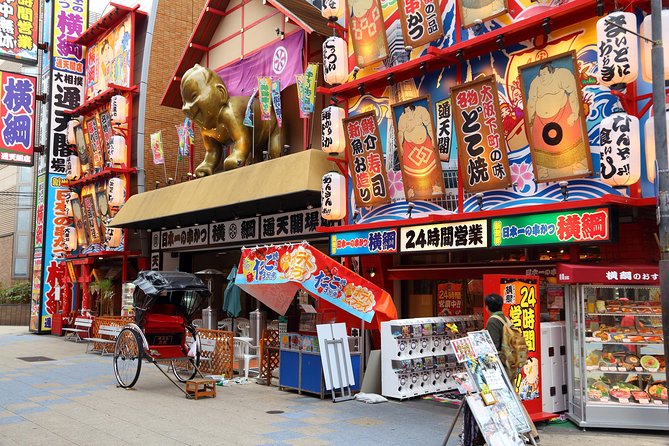 Osaka Private Pop Culture Tour: Historic Tenma to Dotonbori - Dotonbori: giant signs, canal views, and street-food icons