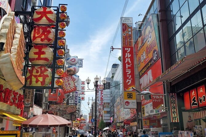 Osaka: Walking Tour to Local Gems, Food & Culture - Dotonbori Photo Stop: Learn the Symbols, Not Just the Scenery