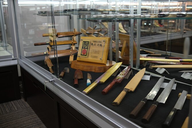 Sakai - Knife Factory and Craft Walking Tour - Stop 2: entering a working Sakai knife factory and sharpening station