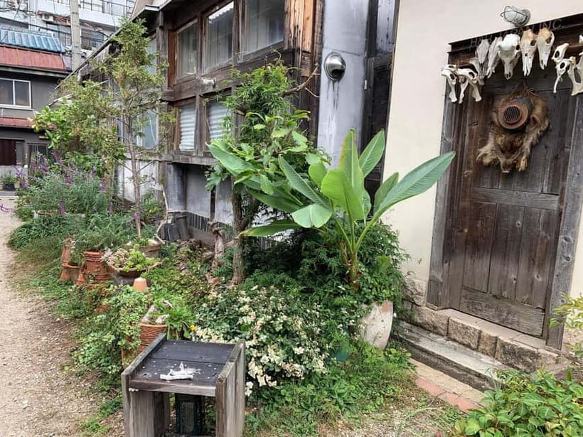 Urban Canvas: Osaka Street Art Bike Tour - Stop 1 in Osaka: train lines, rivers, bridges, and an underground story